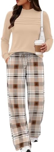 A soft beige plaid knit set pairs a mock neck top with wide-leg printed trousers for easy travel days and cool evenings.