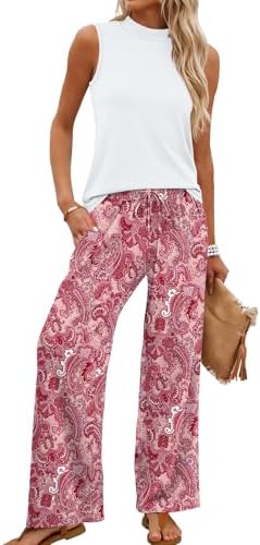 A soft floral pink two-piece set pairing a sleeveless mock neck cropped top with airy wide-leg printed trousers.