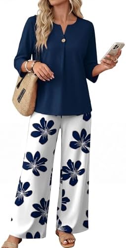 Crisp blue botanical motifs across an ivory base bring breezy vacation charm to this three-quarter sleeve top and wide-leg pant set.