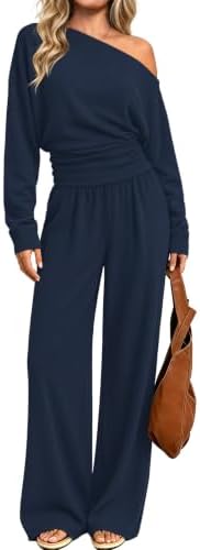 A deep navy knit pairs an asymmetrical off-the-shoulder long sleeve top with relaxed wide-leg trousers for cooler days.