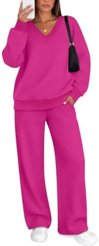 Cut in a bright hot pink knit, this two-piece set pairs a relaxed V-neck pullover with comfortable wide-leg sweatpants.