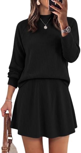 Deep black knit shapes this coordinated pairing of a long sleeve mock neck top and a swingy high-waisted skirt.