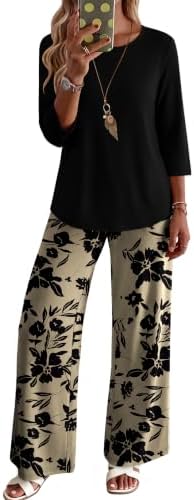Bright yellow floral blooms stand out against deep black on this easy two-piece lounge set with three-quarter sleeves and pockets.