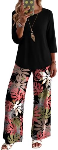 Saturated hot pink florals stand out against a black ground in this matching two-piece set cut with three-quarter sleeves.