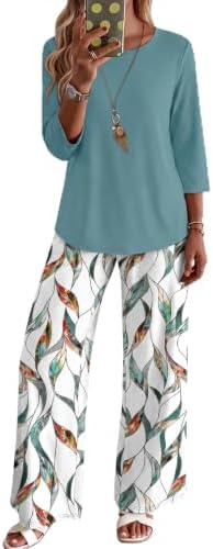 Crisp white graphic florals scatter across cool lake blue in this soft knit two-piece set cut with elbow-grazing sleeves.