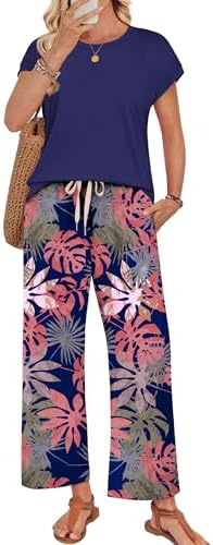 A deep navy backdrop sets off the airy botanical print across this soft cap-sleeve top and wide-leg pant set.