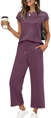 A deep dark purple two-piece set cut from silky spacer knit, pairing a pleated cap-sleeve top with cropped wide-leg pants.