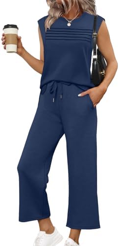 Spacer knit gives this navy two-piece set an airy drape, combining a pleated cap-sleeve top with cropped wide-leg pants.
