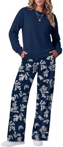 A dark blue tree motif covers this soft two-piece set, featuring a long-sleeve crewneck top and full-length wide-leg pants.