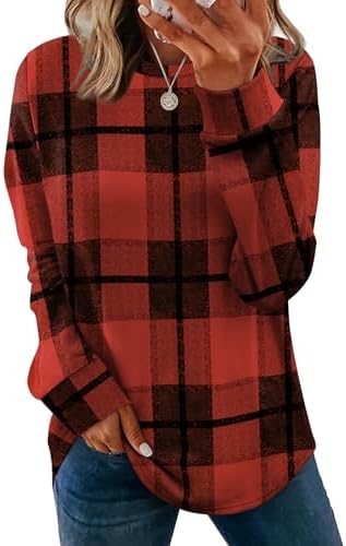 Crisp red plaid patterns this long-sleeve crewneck tunic, cut loose through the body with a curved hem that pairs easily with leggings.
