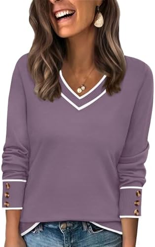 Cool purple color blocking meets a wide V-neck in this relaxed pullover sweater with neat button cuffs.
