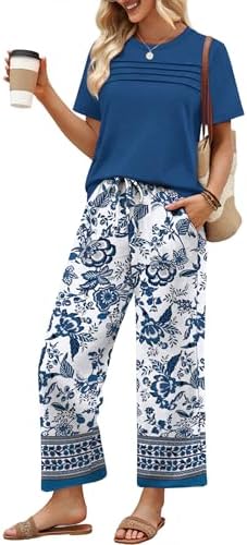 A breezy two-piece set pairing a pleated knit top with wide-leg cropped pants in a bold blue ethnic print.