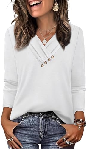 A crisp white tunic cut with a neat V-neckline and decorative center buttons that layer cleanly under a tailored jacket.