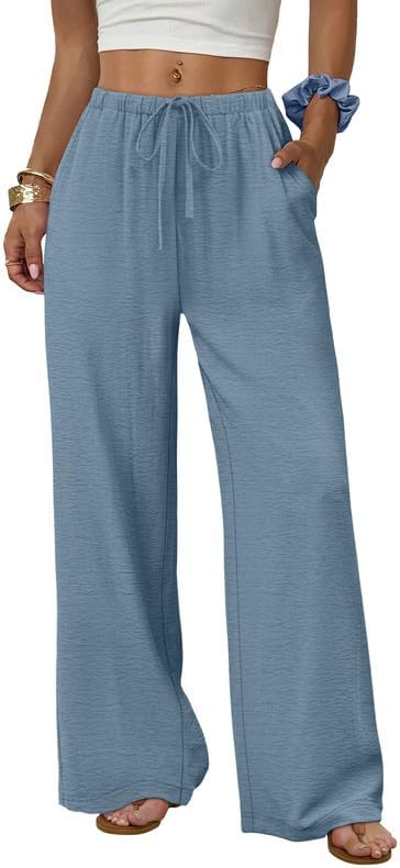 Airy polyester knit drapes into a wide leg cut with deep side pockets and an adjustable drawstring waist.