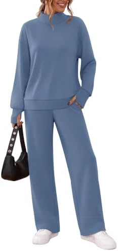A cool blue shade defines this cozy two-piece lounge set, cut with a high mock neck, thumbhole sleeves, and relaxed wide-leg pants.