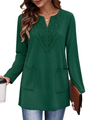 Fine lace trim frames the neckline of this rich green tunic, cut long through the body with deep side pockets.