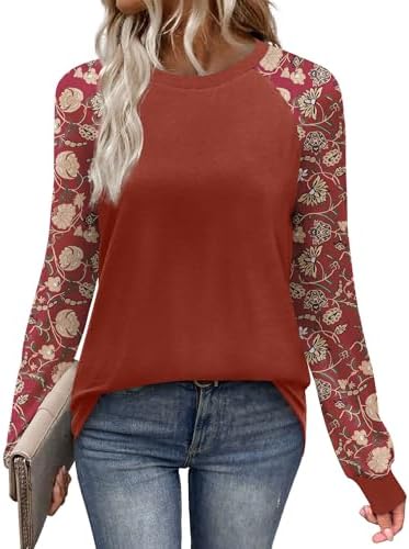 A red floral print brightens the raglan sleeves on this easy crewneck knit cut for breezy summer nights and early fall days.