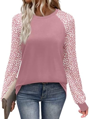 Spotted pink raglan sleeves bring pattern to this soft knit crewneck top cut for easy cool weather layering.
