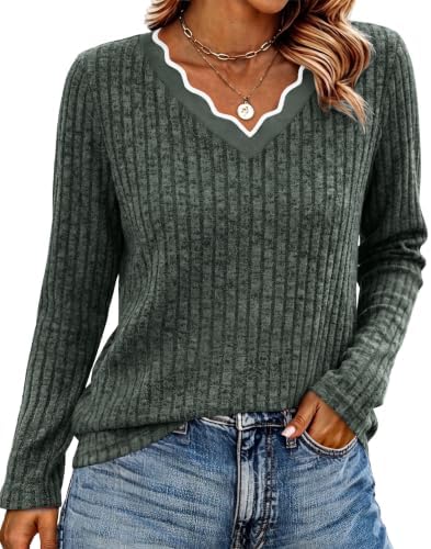 A plush green knit sweater with a scalloped neckline and a relaxed fit, designed for cool morning walks and breezy evenings.