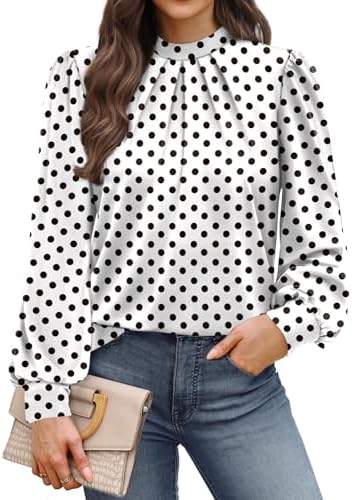 Crisp black dots scatter across a clean white knit, finished with a neat mock neck and soft puffed sleeves for long workdays.