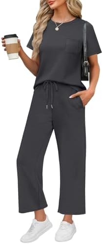 A charcoal dark grey two-piece set cut from silky spacer knit with a crew neck top and wide-leg crop pants.